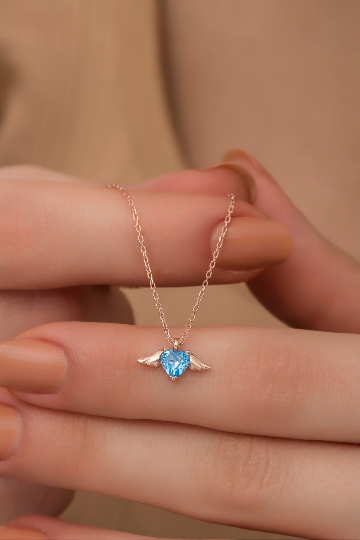 Winged flying heart necklace
